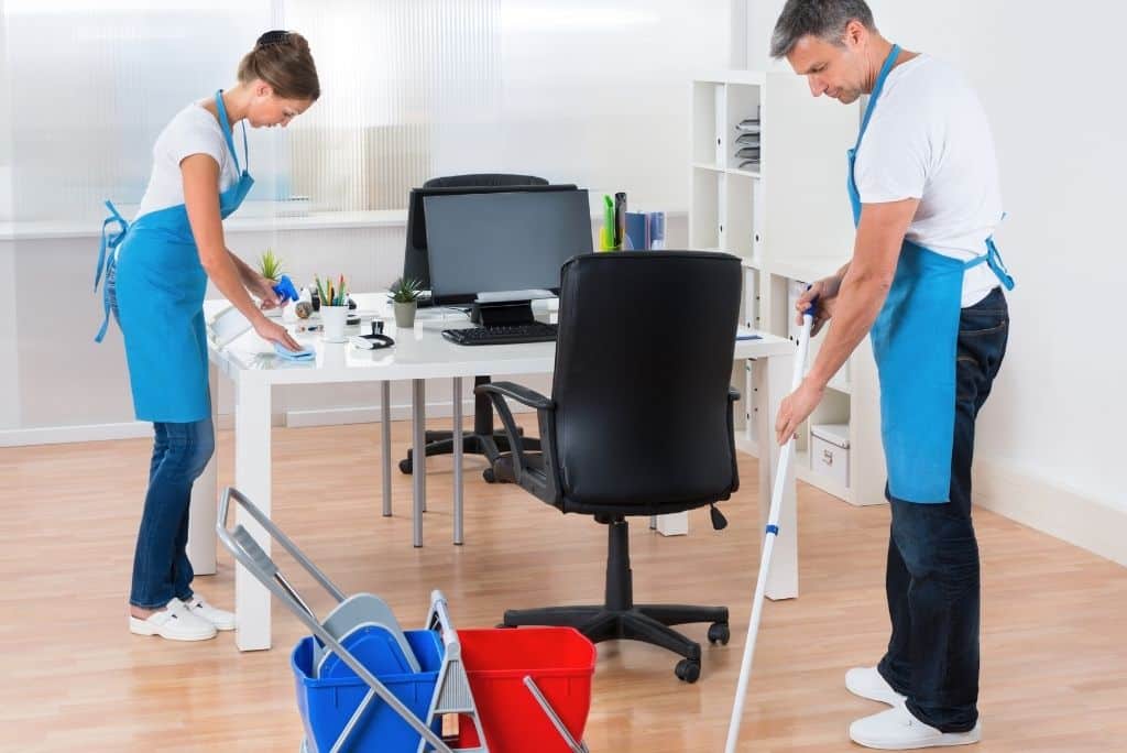 Professional office cleaning services team disinfecting workspace in Staten Island